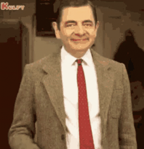 Mr Bean Smiling In Suit And Tie GIF