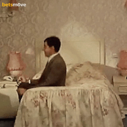 Mr Bean Waiting Jumping On The Bed GIF