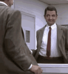 Mr. Bean Watching Himself Doing The Funny Dancing GIF