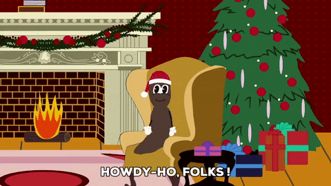 Mr Hankey Seating Beside Christmas Tree GIF