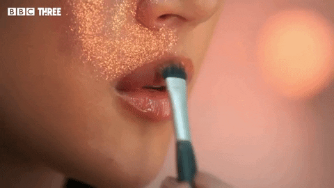 Mua Puts Glitter On Lips GIF