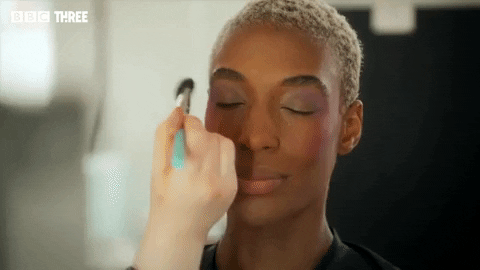 Mua Puts Powder On Model GIF