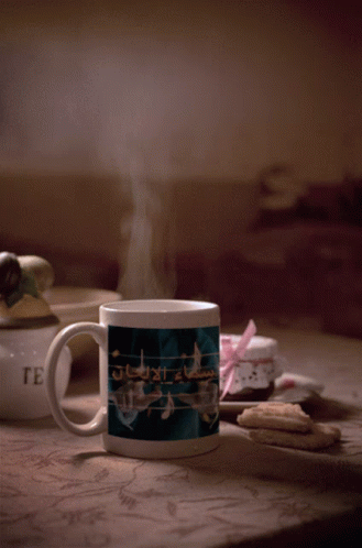 Mug With Music Notes Next to Cookies