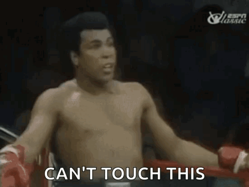 Muhammad Ali Is Standing In A Boxing Ring And Saying `` Can T Touch This '' . GIF
