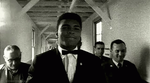 Muhammad Ali Smiling While Walking GIF