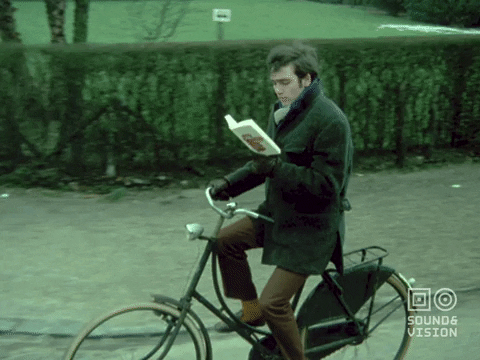 Multitasking Bicycle Ride And Reading GIF