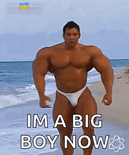 Muscular Man in Bikini on Beach