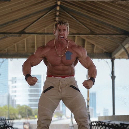 Muscular Man With Blue Arrow In Front Of Gazebo GIF