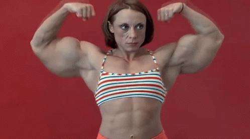 Muscular Woman In Striped Top Flexing Against Red Background GIF
