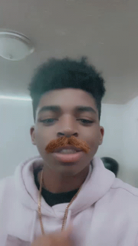 Kid Showing Fake Walrus Mustache GIF