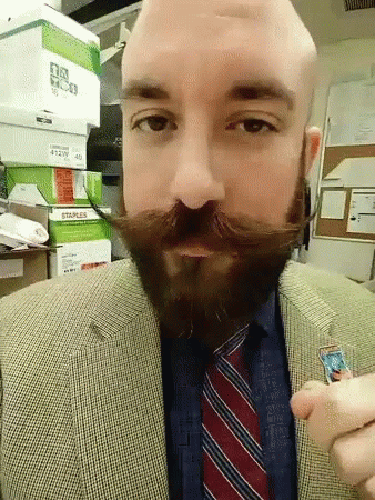 Cocky Guy Showcasing Well Groomed English Mustache GIF
