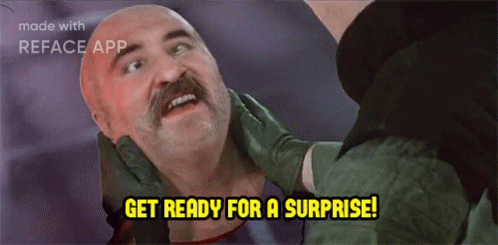 Mustache Man Held by Another Saying Get Ready for a Surprise