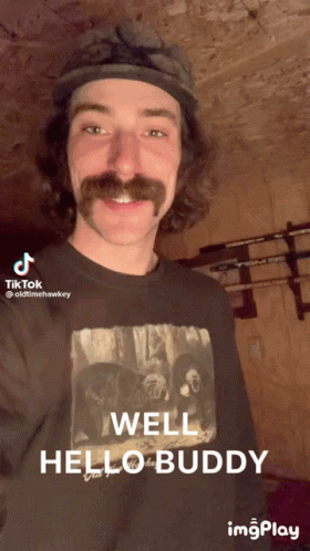Mustached Man Black Shirt Saying Well Hello Buddy