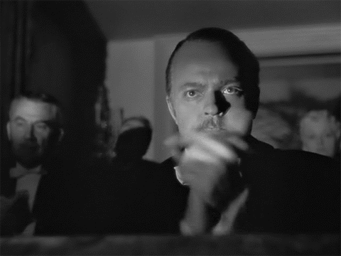 Mustached Man Clapping While Another Watches Black and White