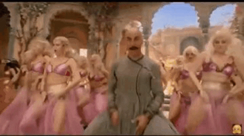 Mustached Man Dancing With Women In Pink Dresses GIF