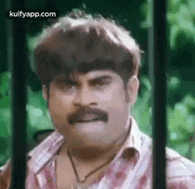 Mustached Man Funny Face Behind Bars