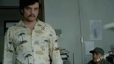 Mustached Man in Hawaiian Shirt with Another Man