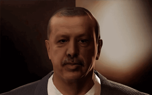 Mustached Man in Suit Looking at Camera
