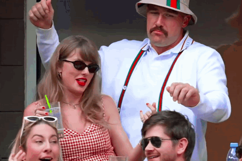Mustached Man Thumbs Up Woman in Sunglasses