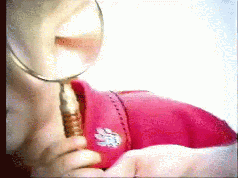 Cute Boy Magnifying Mystery Clues GIF