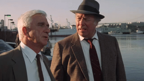 Naked Gun Captain Ed Hocken And Frank Drebin GIF