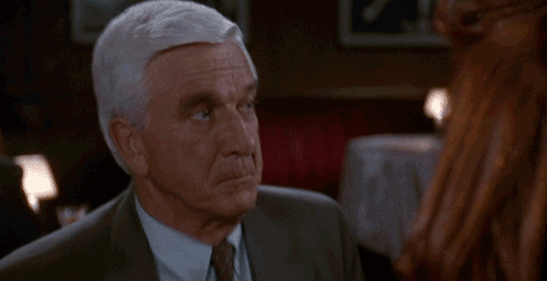 Naked Gun Frank Drebin Blocking Jane Spencer Slap GIF