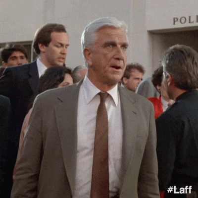 Naked Gun Frank Drebin Looking Sideways GIF