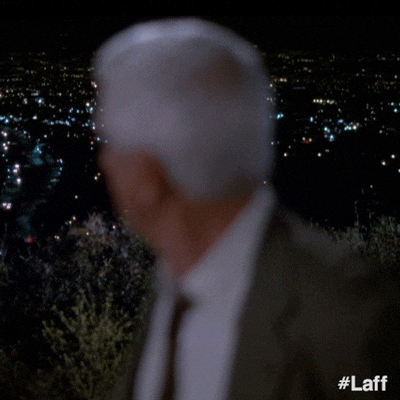 Naked Gun Frank Drebin Looking Surprised GIF