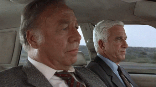 Naked Gun Frank Drebin With Captain Ed Hocken GIF