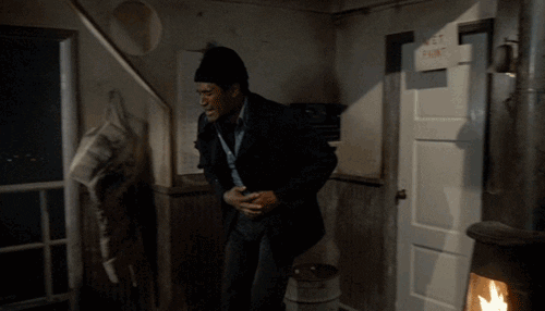 Naked Gun Officer Nordberg Burning His Hand GIF