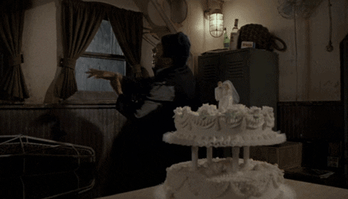 Naked Gun Officer Nordberg Crushing Onto Cake GIF