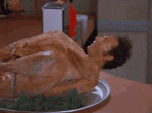 Naked Man Laying on Plate of Food