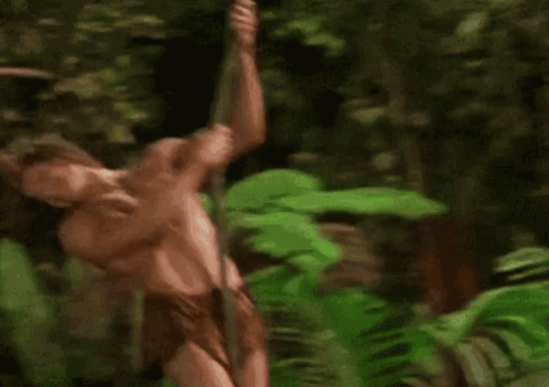 Naked Man With Long Hair Leaning Against Tree GIF