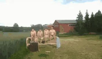 Naked Men Sitting on Bench in Field Near Lake
