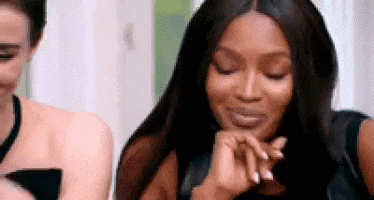 Naomi Campbell Tries Holding Back To Laugh GIF