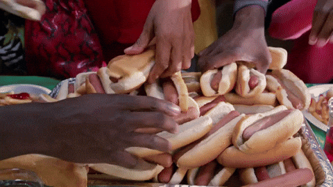 National Hot Dog Day Lady Getting Sandwich GIF