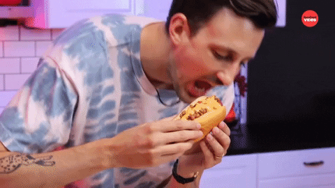 National Hot Dog Day Man Biting Sandwich GIF