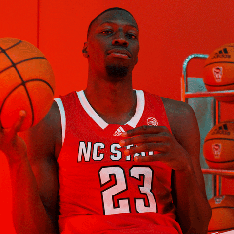 Nc State Guy Sitting Playing With Ball GIF