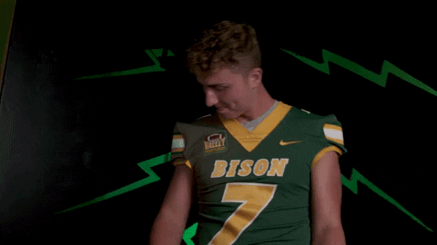 Ndsu Football Player Joggling Oval Shaped Ball GIF