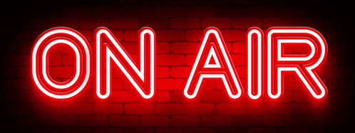 Neon ON AIR Sign On Red Brick Wall GIF