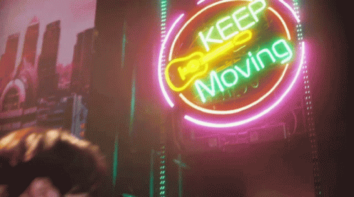 Neon Sign Saying Keep Moving