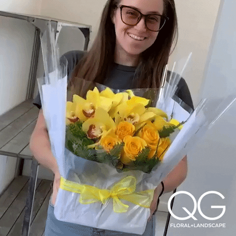Nerdy Girl Giving Flowers GIF