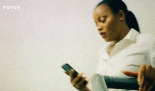 Nervous Woman Secretly Sneaking On Phone GIF