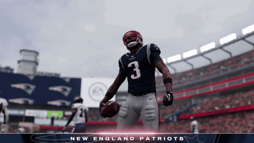 New England Patriots Football Player Holding Football