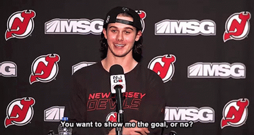 New Jersey Devils Shirt Man Talking Into Microphone