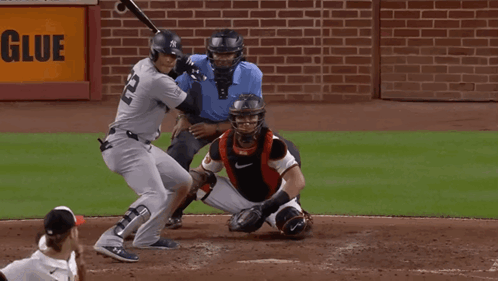New York Baseball Player Swinging at Pitch