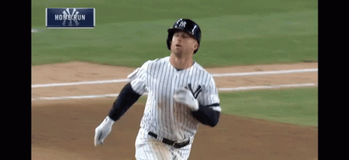 New York Yankees Baseball Player Runs Toward Home Plate