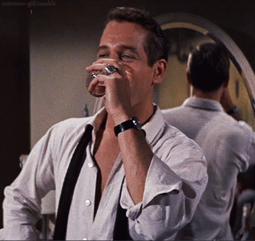 Newman Smirking And Drinking GIF