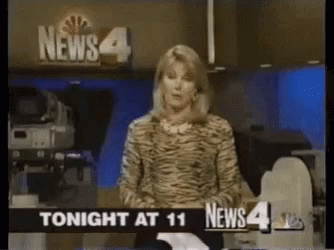 News Anchor in Front of News 4 Sign