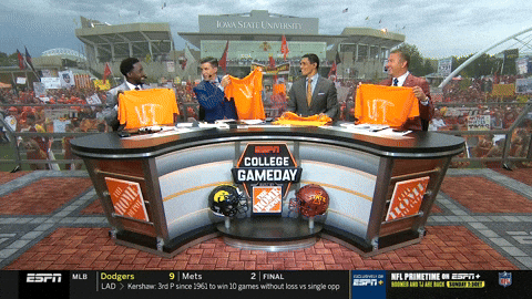 News Casters Holding Up Rocky Top Jersey GIF
